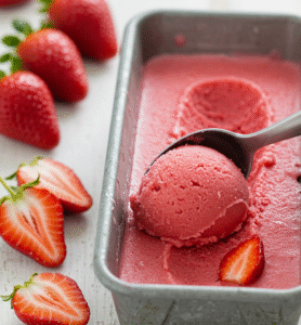 scooping strawberry sorbet for summer