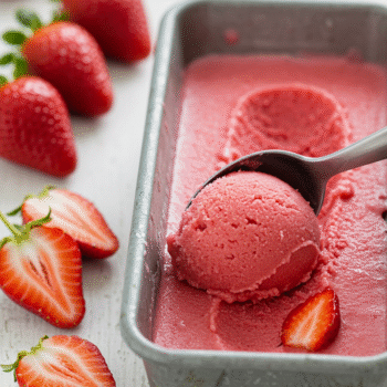 scooping strawberry sorbet for summer